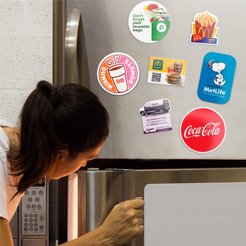 Woman Opening Fridge With Magnets 
